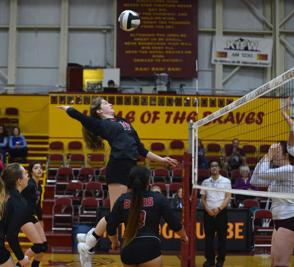 Juneau-Douglas High School's Kendyl Carson spikes the  ball against Ketchikan High School Region on Saturday during the Region V tournament in Sitka.