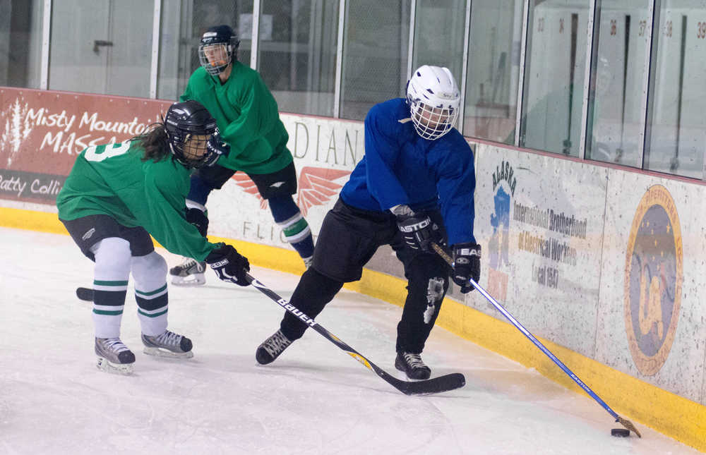 Amber Treston (green) chases down Besty Haines during a Friday evening Juneau Jamboree contest at Treadwell Ice Arena.
