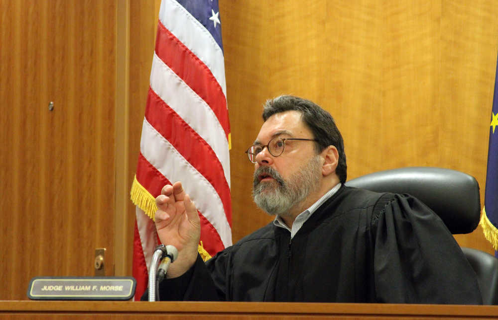 Alaska Superior Court Judge William Morse gestures while questioning  Sen. Bill Wielechowski, D-Anchorage, during a hearing Thursday, Nov. 17, 2016, in Anchorage, Alaska. Morse ruled against Wielechowski, who sued the state along with two former lawmakers, contending Gov. Bill Walker didn't have the authority to reduce this year's Alaska Permanent Fund dividend. (AP Photo/Mark Thiessen)