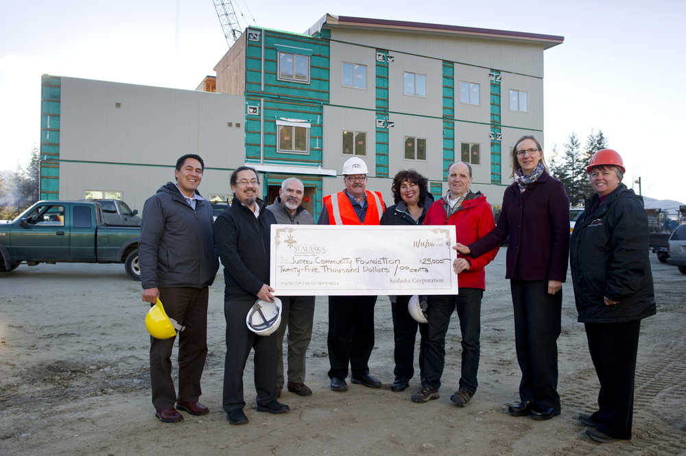 Sealaska presents a $25,000 check to the Juneau Community Foundation to be used on the Housing First Project on Jenkins Drive on Thursday, Nov. 17, 2016. From lef are: Anthony Mallott, president and CEO of Sealaska, Joe Nelson, board chair for Sealaska, John Gaguine, JCF boardmember, Craig Moore, of Tlingit and Haida Housing Authority, Myrna Gardner, of Tlingit and Haida Housing Authority, Bruce Denton, Juneau Housing First boardmember, Amy Skilbred, exective director of JCF, and Joyce Niven, of Tlingit and Haida Housing Authority