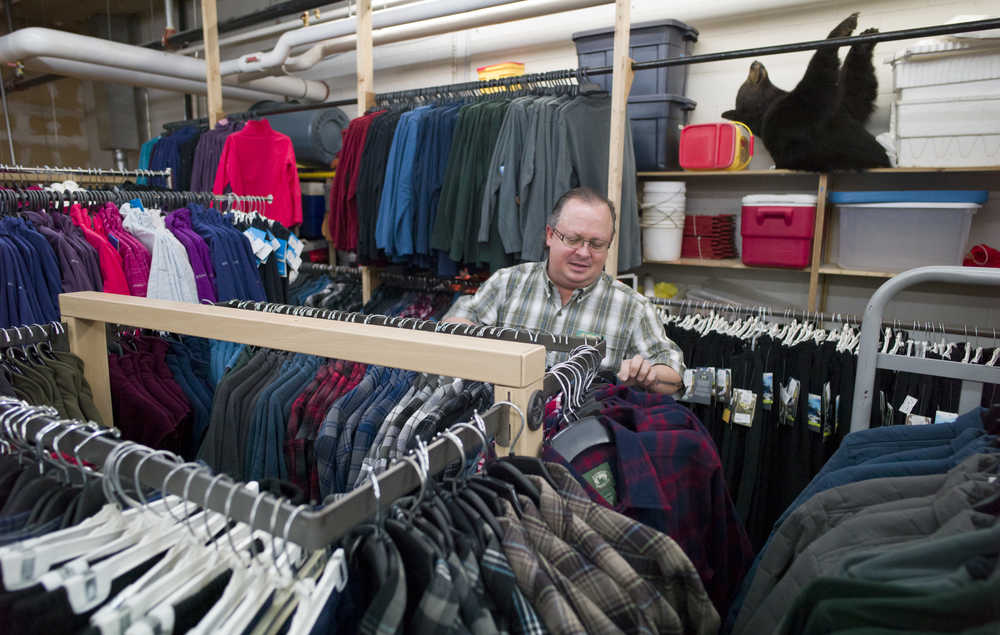 Ken Hill prepares clothing in the Nugget Alaskan Outfitters' warehouse on Tuesday, Nov. 22, 2016, for the Black Friday sales event which runs from 7 a.m to 8 p.m.