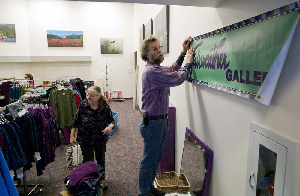 Christie and Colin Jones of Sitka prepare their Fairweather Gallery space for Public Market on Wednesday, Nov. 23, 2016. Public Market starts Friday at noon and runs through Sunday.