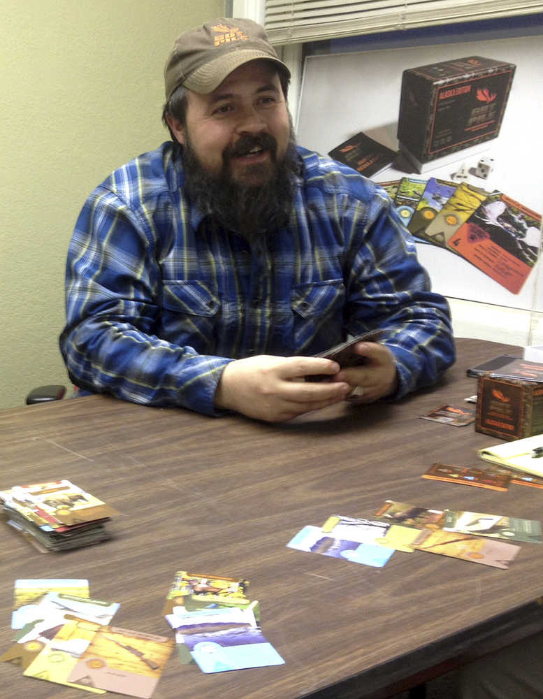 In this Oct. 24 photo, Jim Clark plays a game of Gut Pile in Fairbanks.