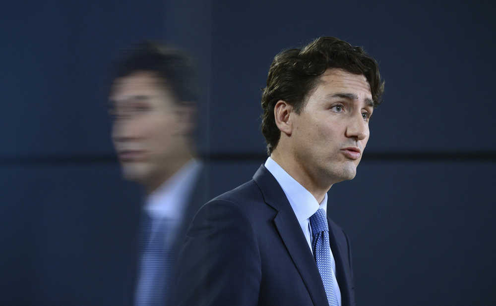 Canada's Prime Minister Justin Trudeau holds a press conference at the National Press Theatre in Ottawa, Ontario, on Tuesday, Nov. 29, 2016. Trudeau has approved one controversial pipeline from the Alberta oil sands to the Pacific Coast, but rejected another. On Tuesday, he approved Kinder Morgan's Trans Mountain pipeline to Burnaby, British Columbia, but rejected Enbridge's Northern Gateway pipeline to Kitimat, B.C.  (Sean Kilpatrick/The Canadian Press via AP)