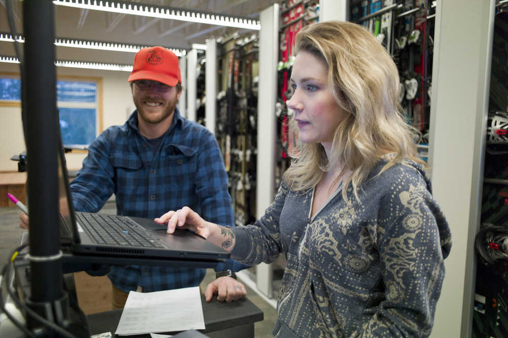 Rental Shop Supervisor Ben Hines goes over the shop's computer system with Kelsey Lovig on Thursday, Dec. 1, 2016, as they prepare for this weekend's opening at Eaglecrest.