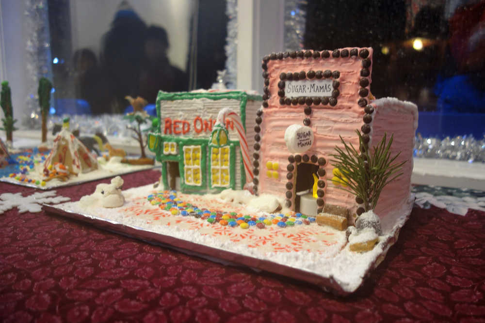 A gingerbread house of the Red Onion Saloon and Sugar Mama's is on display in a window in Skagway.