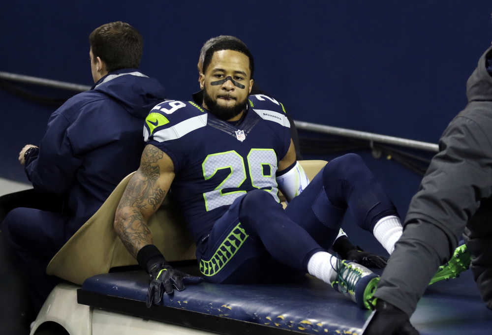 Seattle Seahawks' Earl Thomas leaves the field on a cart after being injured against the Carolina Panthers in the first half of an NFL football game, Sunday, Dec. 4, 2016, in Seattle. (AP Photo/Stephen Brashear)
