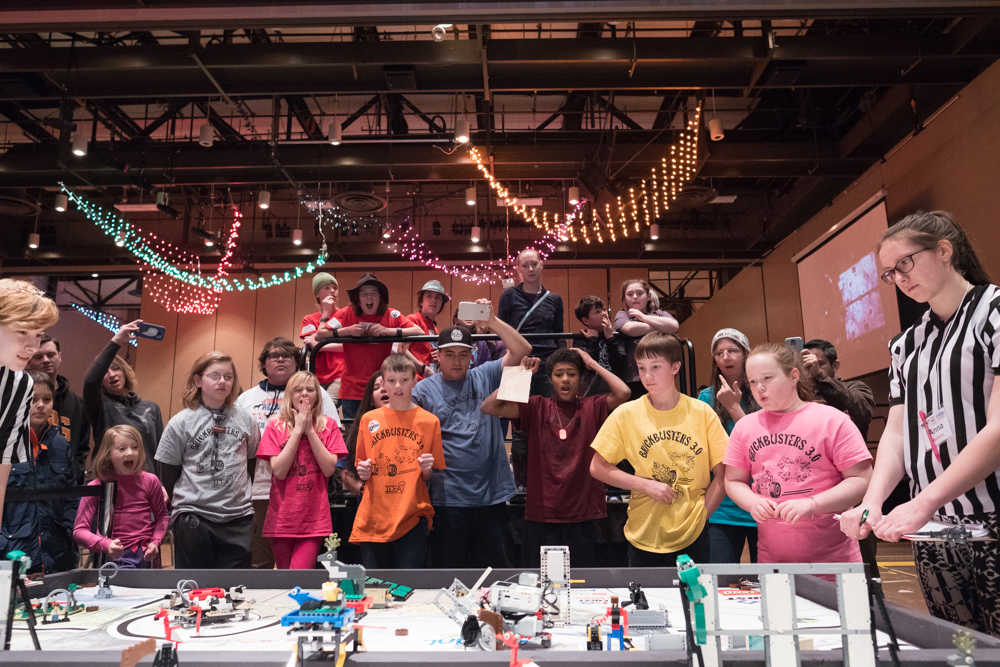 Brickbusters 3.0 and fans look on as their robot completes its mission during the 10th Annual Robot Jamboree competition. The competition was held Saturday afternoon at Centennial Hall.
