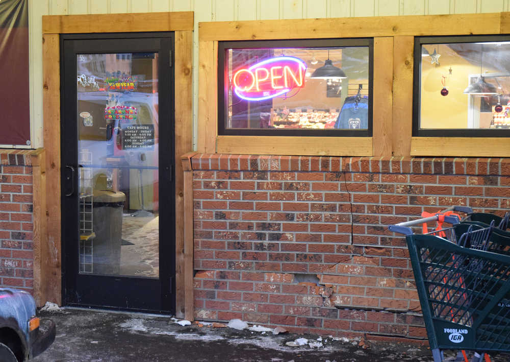 Dented but still open, the front facade of the Foodland IGA grocery store is seen Monday, Dec. 12, 2016. According to the Juneau Police Department, a green Chevrolet Tahoe driven by a drunken man struck the building on Sunday evening. No one was injured, and the man is under arrest.