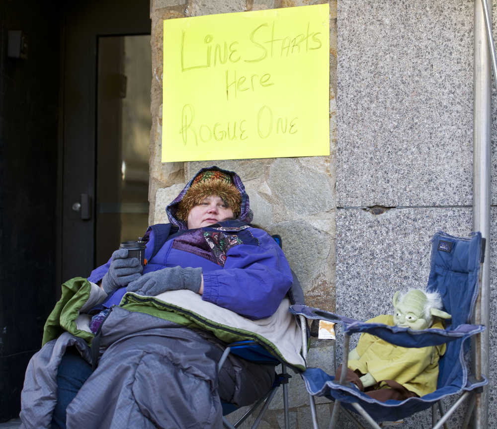 Lynn Roldan is the first to line up before noon at 20th Century Theatre on Thursday, Dec. 15, 2016, on Front Street for the midnight first showing of the Star Wars spinoff "Rogue One." Roldan said, "I have nothing else on Thursdays and its my day off. Movies are my thing. I come out, people watch and have fun."