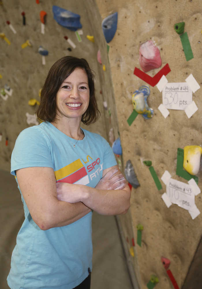 In this Dec. 8 photo, Emily Mengershausen poses for photos at Ascension Rock Club in Fairbanks. Mengershausen, one of Fairbanks' premier climbing instructors, taught herself to climb and started competing after she was injured as a young gymnast.