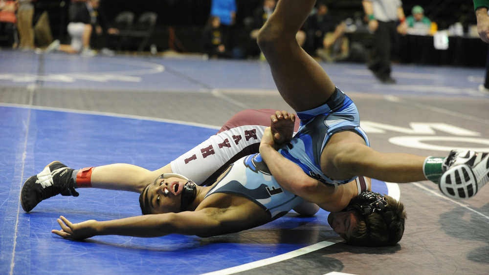 Jahrease Mays, of Thunder Mountain High, and Matthew Rodriguez, of Ketchikan High, compete in the 106 lb. class in the semifinals of the 4A Alaska State Wrestling Championships at the UAA Alaska Airlines Center in Anchorage, Alaska, on Friday, December 16, 2016. Rodriguez won the match with a pin. (Bob Hallinen / Alaska Dispatch News)