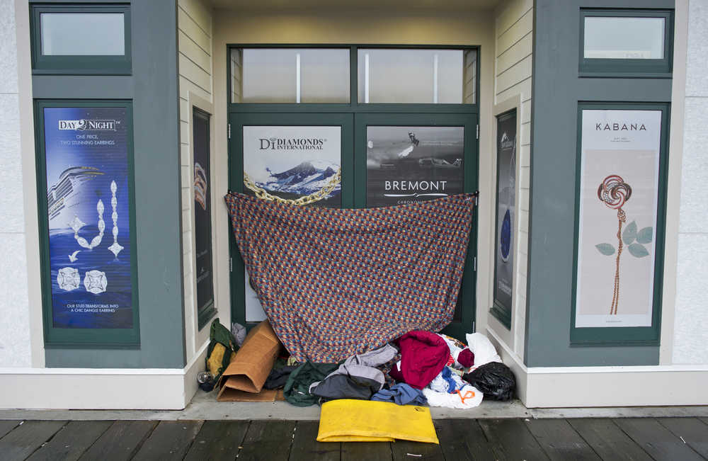 A homeless encampment in the doorway of Dimond International on Wednesday, Dec. 21, 2016.
