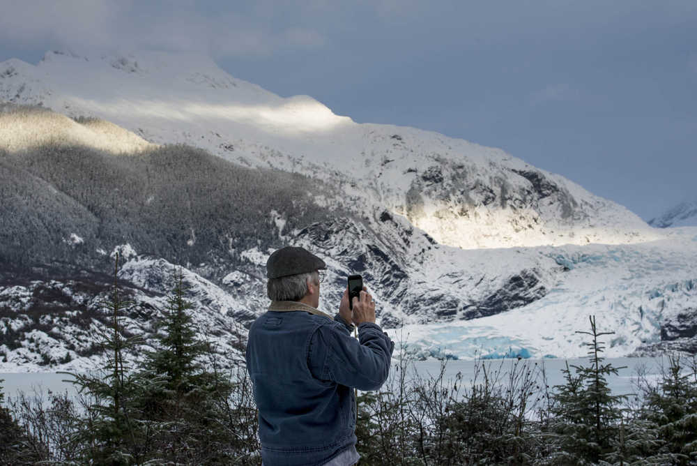 Dean Heard photographs the Mendenhall glacier on Dec. 22, 2016. Heard said, "I like to come out here every day, just to look. Even if the weather's not so nice."