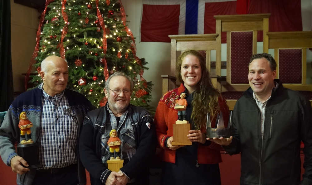 From left to right, pickled herring competition winners Sig Mathisen, Bob Olsen, Carolyn Kvernvik and Adam Swanson (standing in for his dad Rob) pose with their trophies.