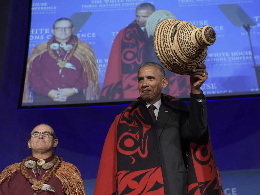 FILE - In this Sept. 26, 2016, file photo, President Barack Obama tips he hat as he stands with Brian Cladoosby, President of National Congress of American Indians, at the 2016 White House Tribal Nations Conference in Washington. The transition to Donald Trump's administration signals a possible end of eight years of sweeping Indian Country policy reforms under Obama, who met with tribal leaders annually. Trump, who rarely acknowledged Native Americans during his campaign, and since the election, hasn't publicly outlined how he would improve or manage the United States' longstanding relationships with tribes. (AP Photo/Susan Walsh, file)