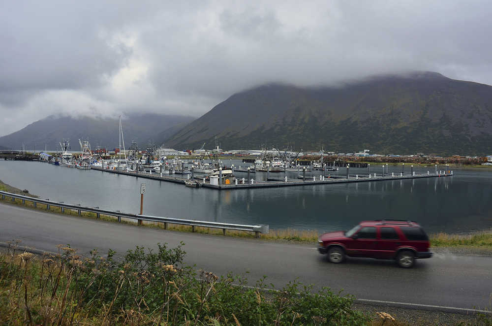 In this Sept. 23, 2013 file photo, a driver passes a small boat harbor in King Cove.