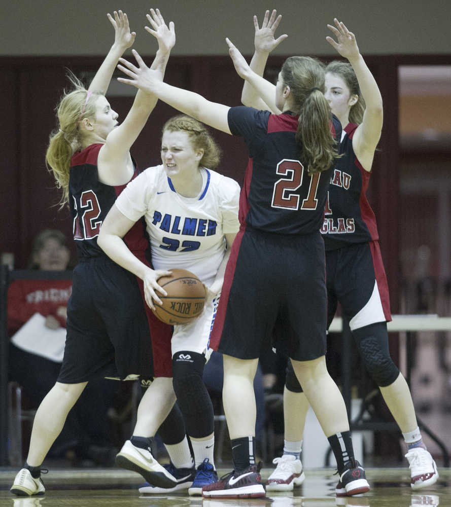 Palmer's Becca Alley finds herself trapped by Juneau-Douglas' Georgia Robinson, left, Cassie Dzinich, center, and Kendyl Carson during the Capital City Classic on Wednesday, Dec. 28, 2016.