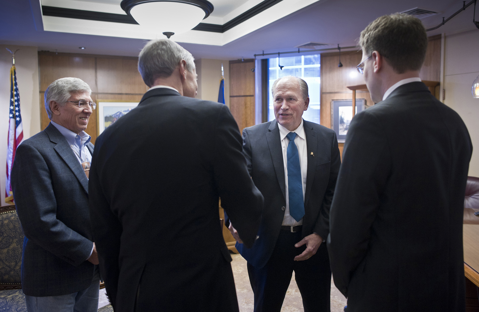 In this Jan. 19, 2016 file photo, Gov. Bill Walker and Lt. Gov. Byron Mallott, left, receive a ceremonial visit by Rep. Matt Claman, D-Anchorage, second from left, and Rep. Lance Pruitt, R-Anchorage, after the House gaveled into session on the first day of the 29th Legislature at the Capitol in Juneau.