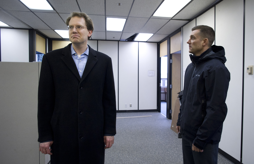 Rep. Lance Pruitt, R-Anchorage, left, pictured last month looking at the new office space for the Legislature at the Bill Ray Center.