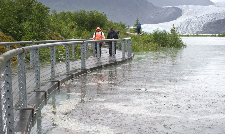 Rising water on Mendenhall Lake was close to closing the Photo Point Trail on Friday.