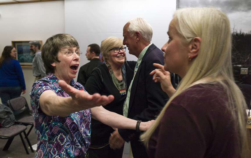 Sara Boesser, left, celebrates with Assembly member Maria Gladziszewski, right, as Mo Longworth greets Mayor Ken Koelsch after the Assembly voted to pass an anti-discrimination ordinance during their Monday meeting.