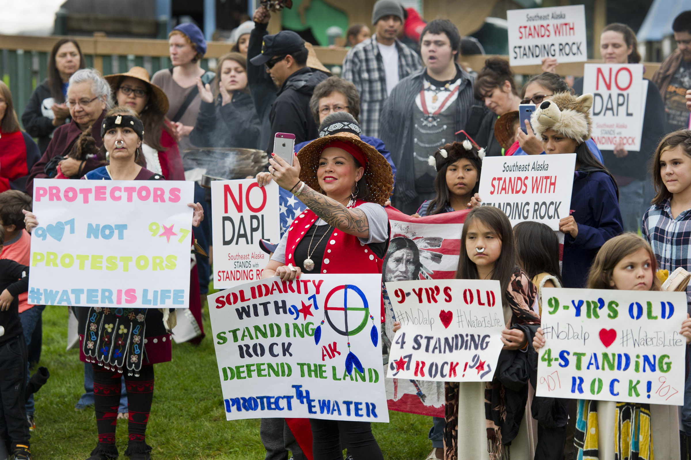 About 100 people attend a rally at Twin Lakes Wednesday evening in solidarity with the Standing Rock Sioux Tribe in North Dakota over the construction of the 1,172-mile Dakota Access pipeline.
