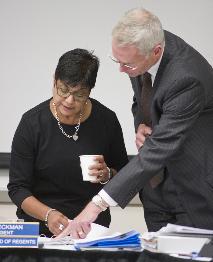 University of Alaska President Jim Johnsen, right, talks with Jo Heckman, chair of the Board of Regents, at the UAS Recreation Center on Thursday.