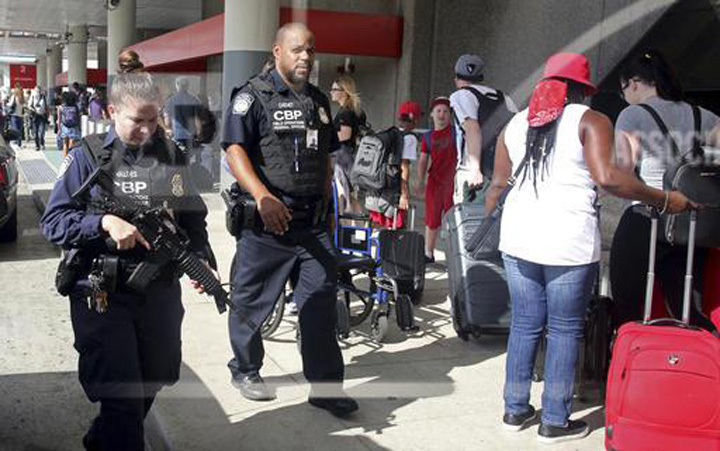 A heavy police presence was at the Ft. Lauderdale-Hollywood International Airport after it re-opened Saturday. Investigators continued their work downstairs in the baggage area of terminal 2 the day after a shooting.