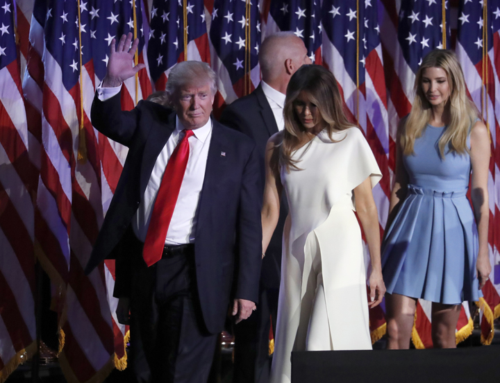 President-elect Donald Trump waves as he walks with his wife Melania Trump followed by his daughter Ivanka Trump after giving his acceptance speech during his election night rally, Wednesday in New York.