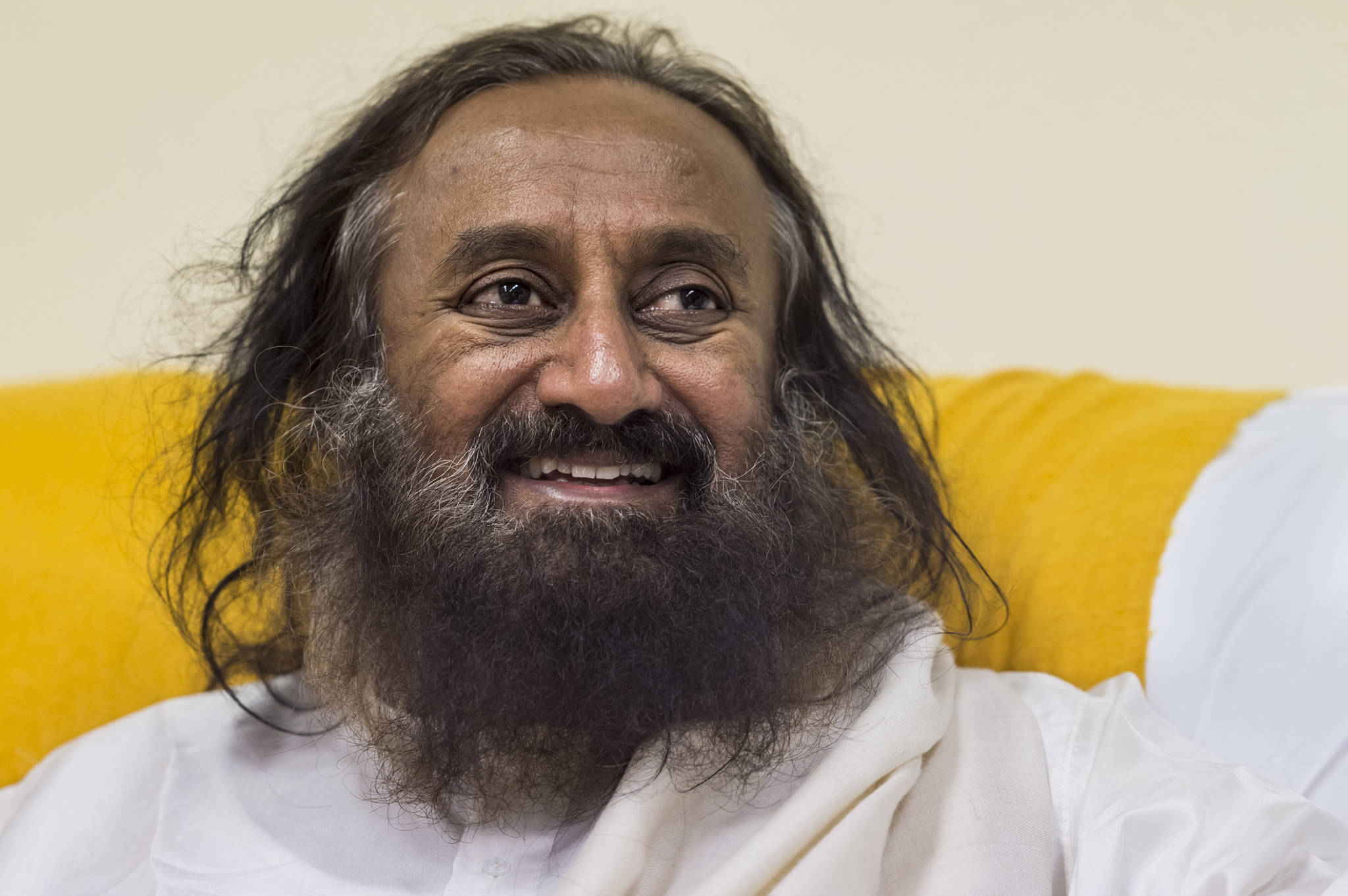 Spiritual leader Sri Sri Ravi Shankar of The Art of Living Foundation speaks during an interview at Juneau-Douglas High School on Tuesday, July 31, 2018, before leading a group meditation in the JDHS auditorium. (Michael Penn | Juneau Empire)