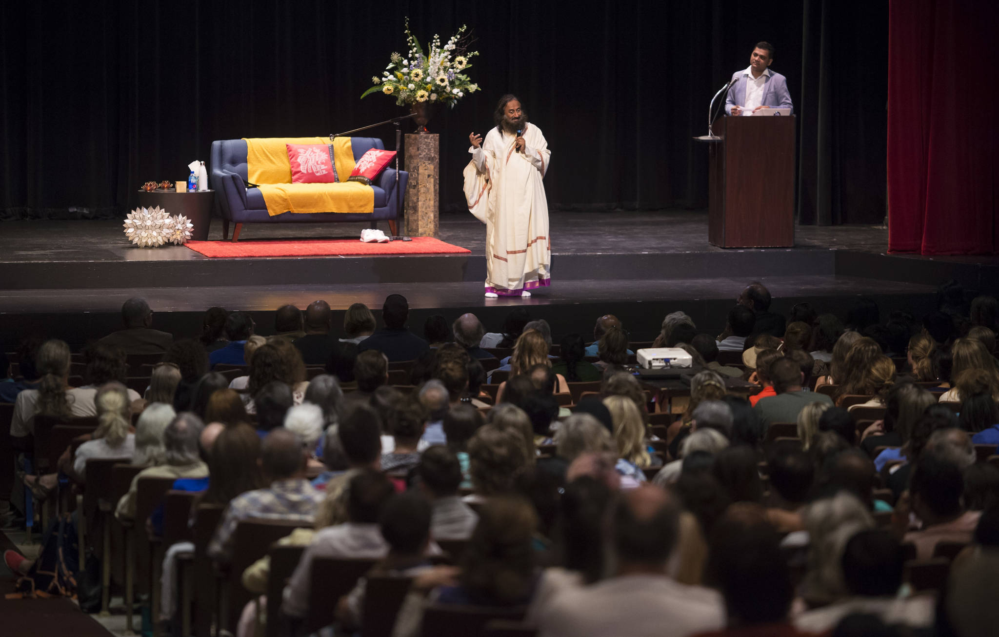 Spiritual leader Sri Sri Ravi Shankar of The Art of Living Foundation leads a group meditation at the Juneau-Douglas High School auditorium on Tuesday, July 31, 2018, as part of his West Coast Tour that also includes San Francisco and Seattle. (Michael Penn | Juneau Empire)