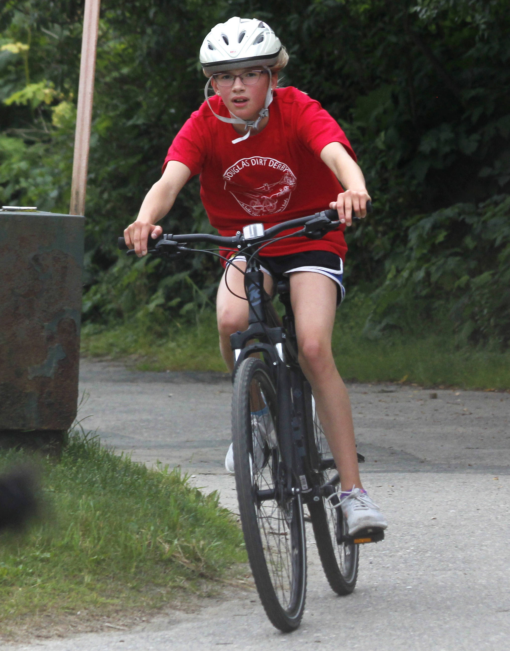 Emma Fellman, 11, rides in the Douglas Dirt Derby on Saturday, Aug. 4, 2018 at Savikko Park in Douglas. Fellman finished second in her age group, and the event raised about $6,000 for the American Diabetes Association. (Alex McCarthy | Juneau Empire)