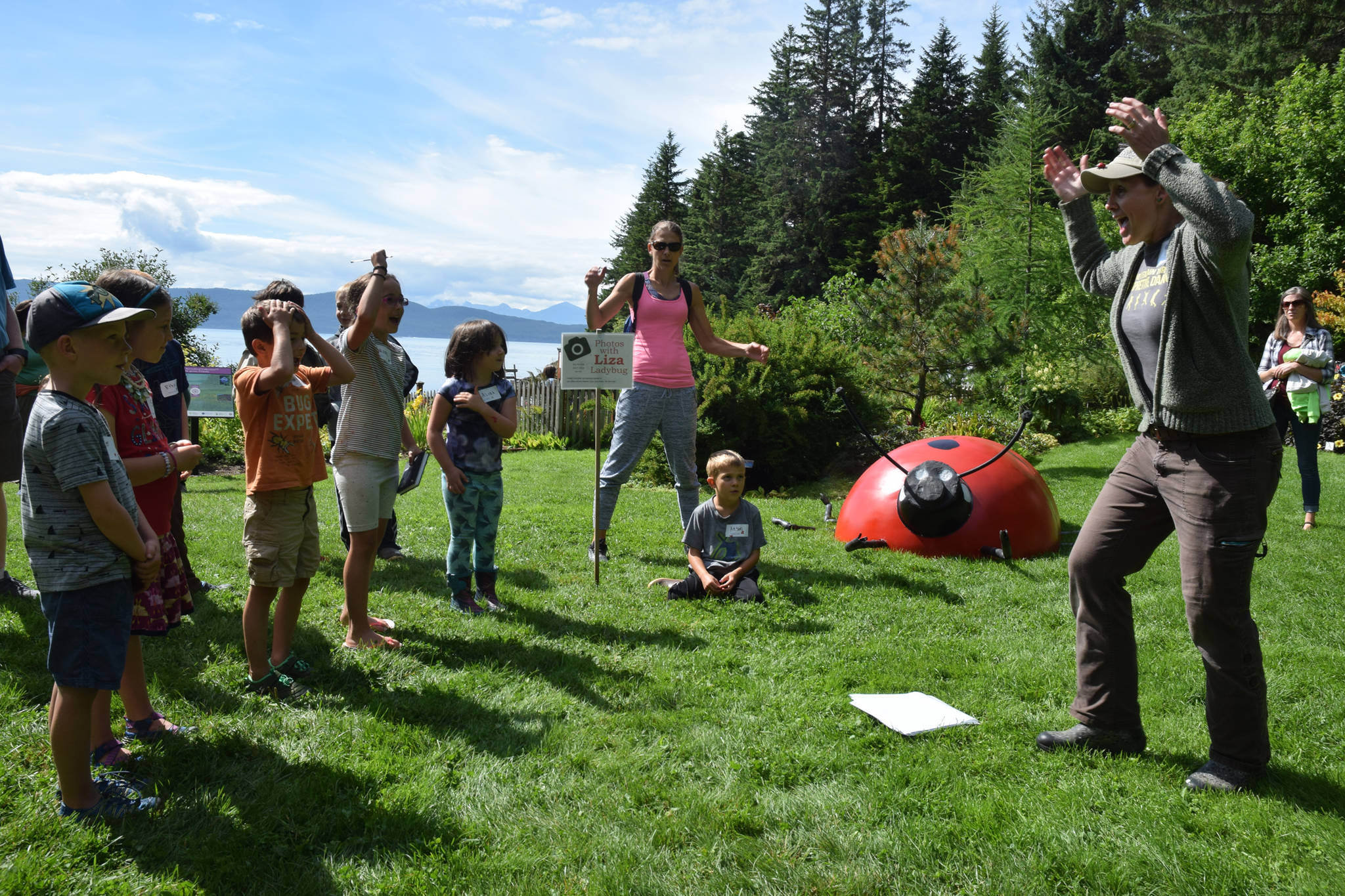 An insect has three body parts, something kids learned with a dance at Bug Day at the Jensen-Olson Arboretum on Saturday, Aug. 11, 2018. (Kevin Gullufsen | Juneau Empire)