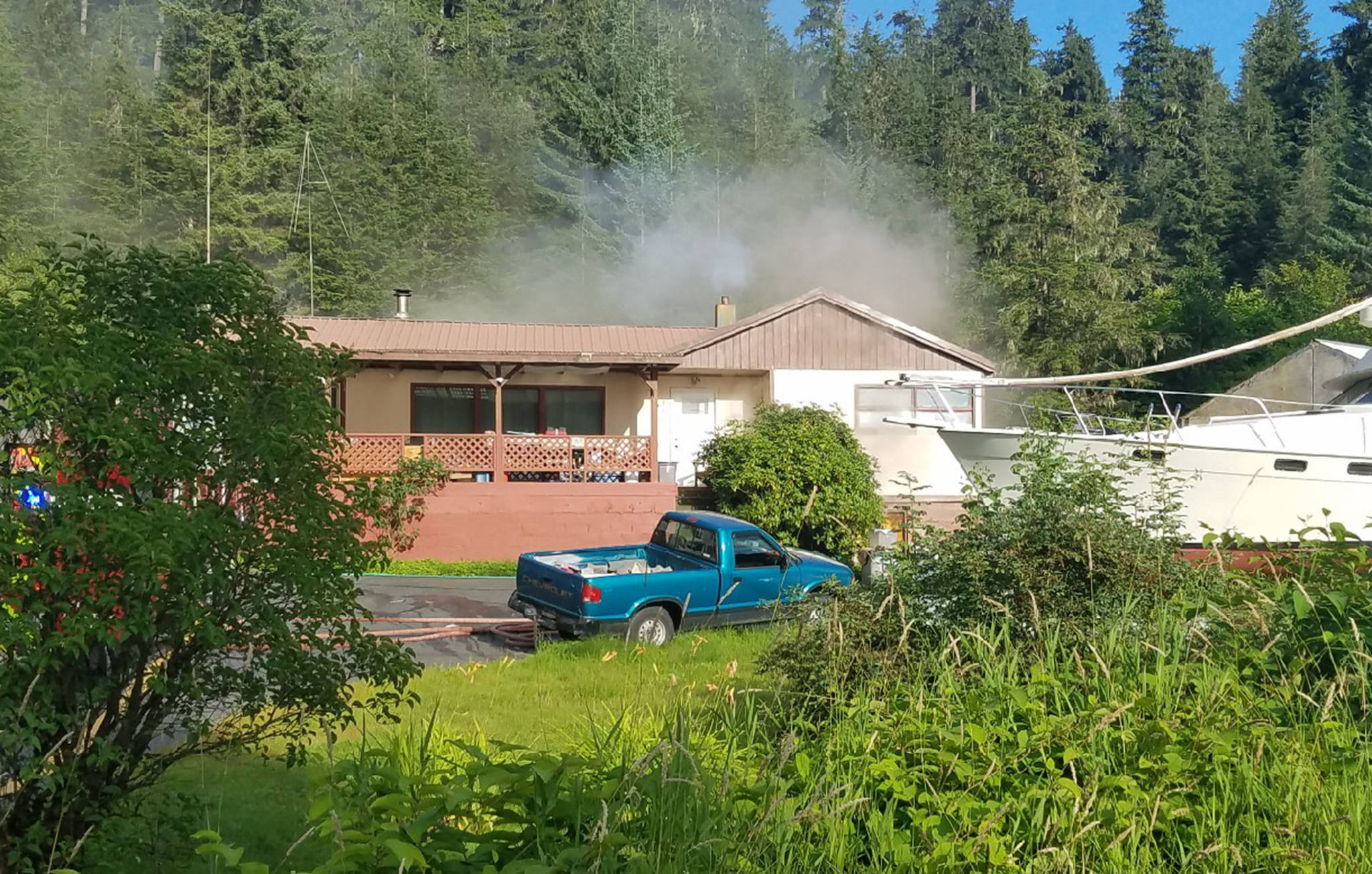 Smoke rises from a home on Fritz Cove Road on Saturday, Aug. 11, 2018. (Capital City Fire/Rescue | Courtesy Photo)