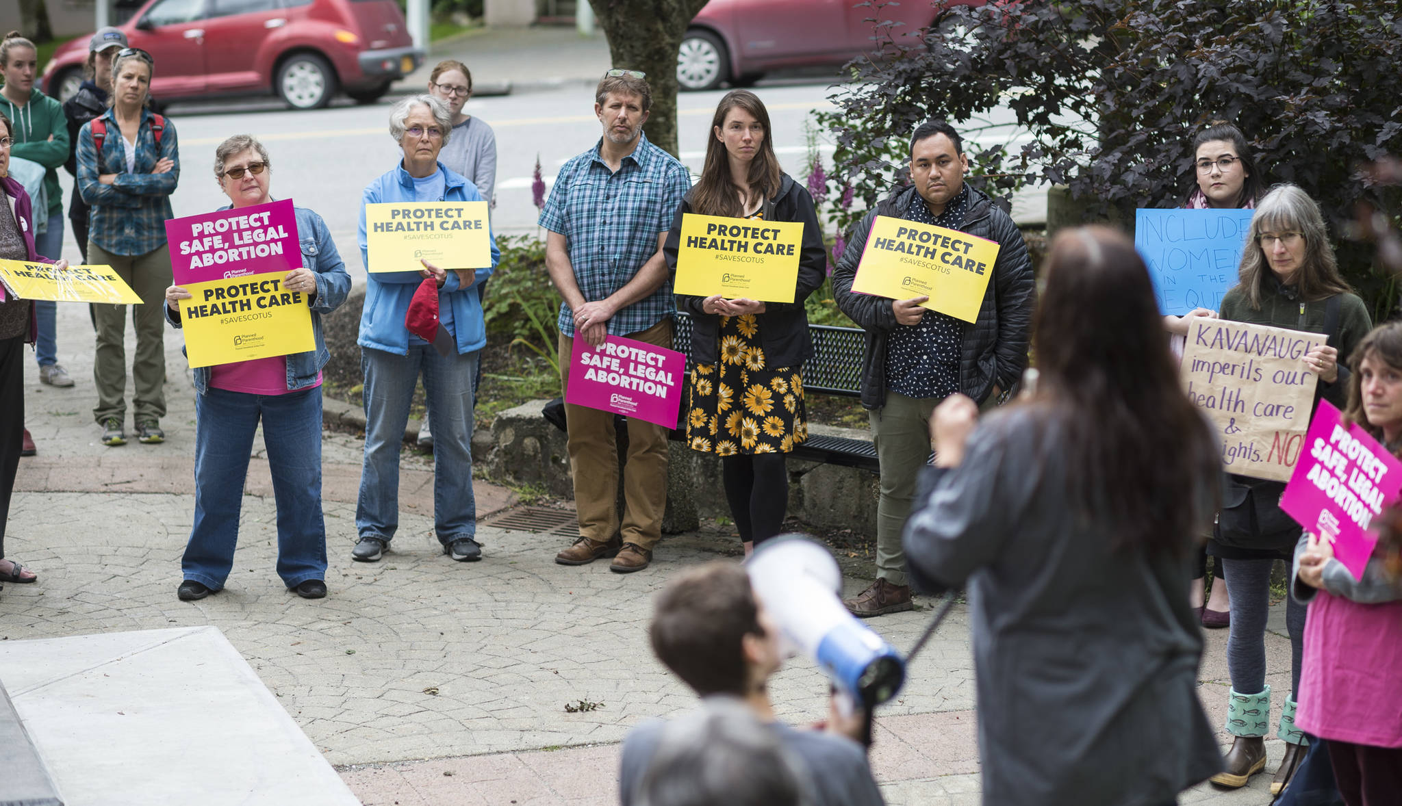 Abortion rights supporters gather in the Dimond Courthouse Plaza on Wednesday, August 15, 2018, to listen to speakers against President Donald Trump’s selection of Judge Brett Kavanaugh to become an Associate Justice of the Supreme Court of the United States. (Michael Penn | Juneau Empire)