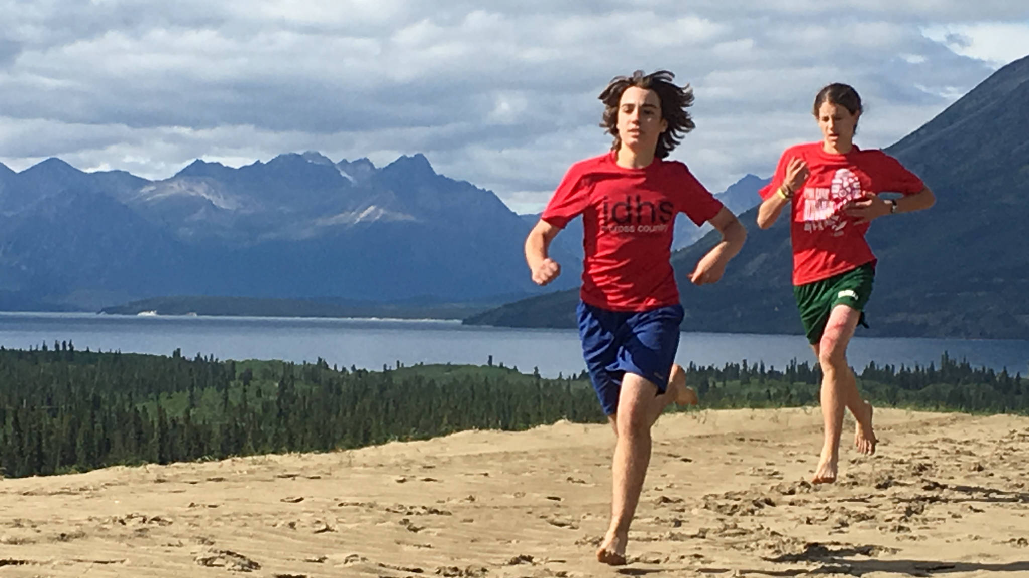 Juneau-Douglas High School runners Callahan Croteau and Ambrose Bucy run outside of Carcross, Yukon, and Lake Bennett, during a Yukon team retreat last Saturday. (Courtesy Photo | Tim Blust)