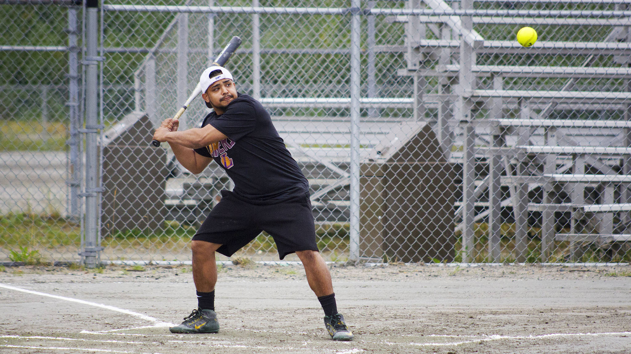 Jonathon Corona drives a ball into left field during a game over the weekend at the 22nd Annual Coed Softball Benefit Tournament at Dimond Park. (Courtesy Photo | Katie Damien)