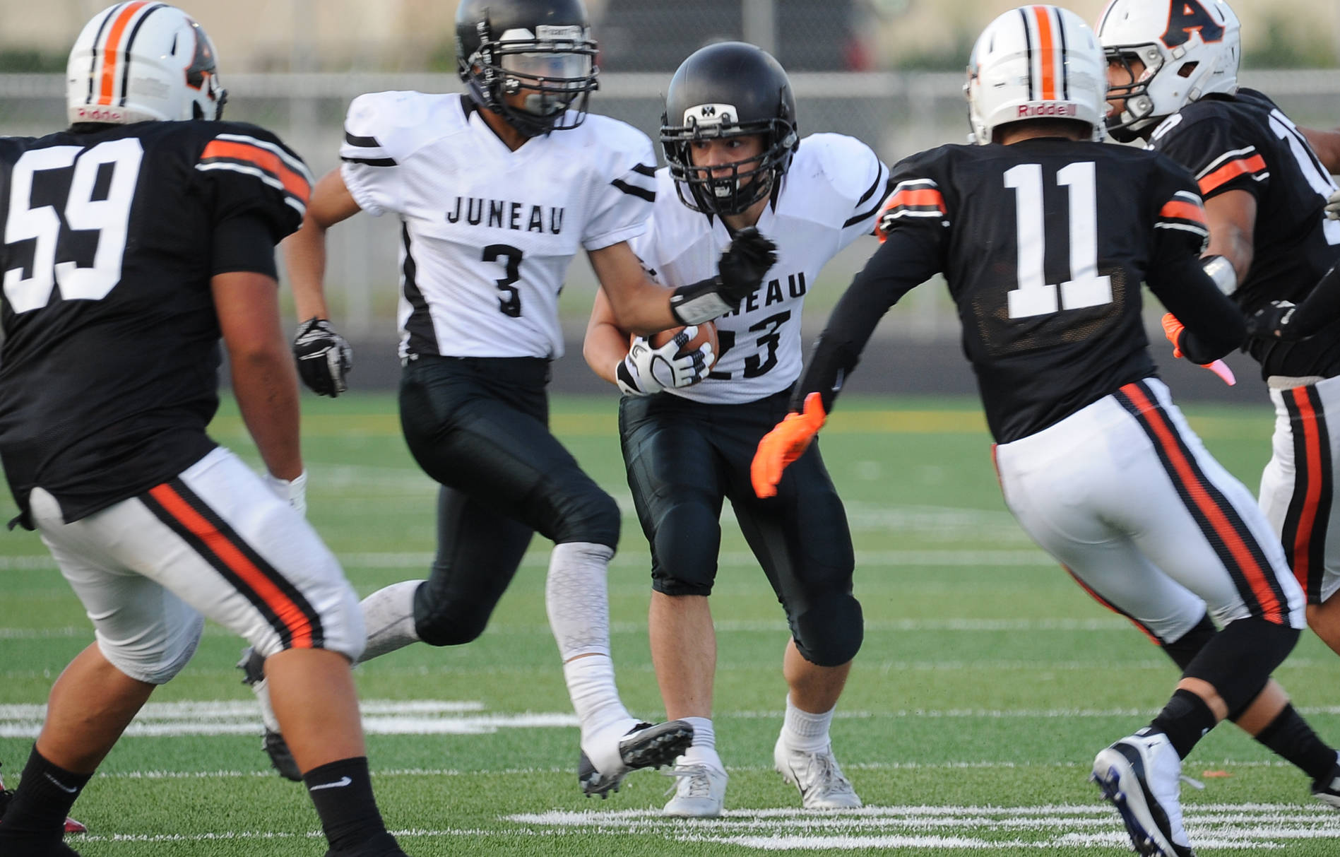 Juneau’s Cody Morehouse looks for room on a kickoff return. (Michael Dinneen | For the Juneau Empire)