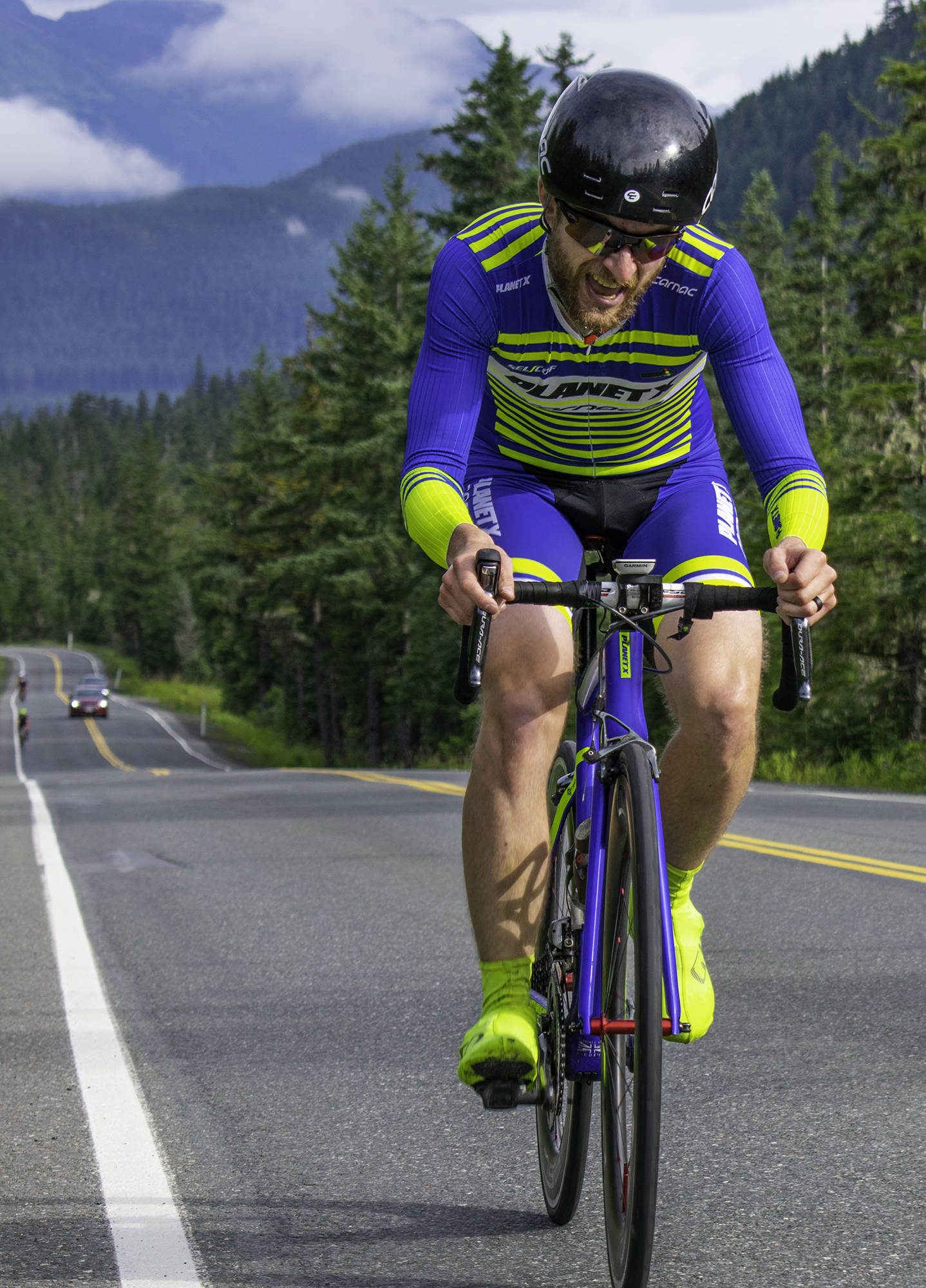 Will Coleman leads the pack midway through the second stage of the Tour of Juneau bike race on Saturday on Eaglecrest Road. (Richard McGrail | Juneau Empire)