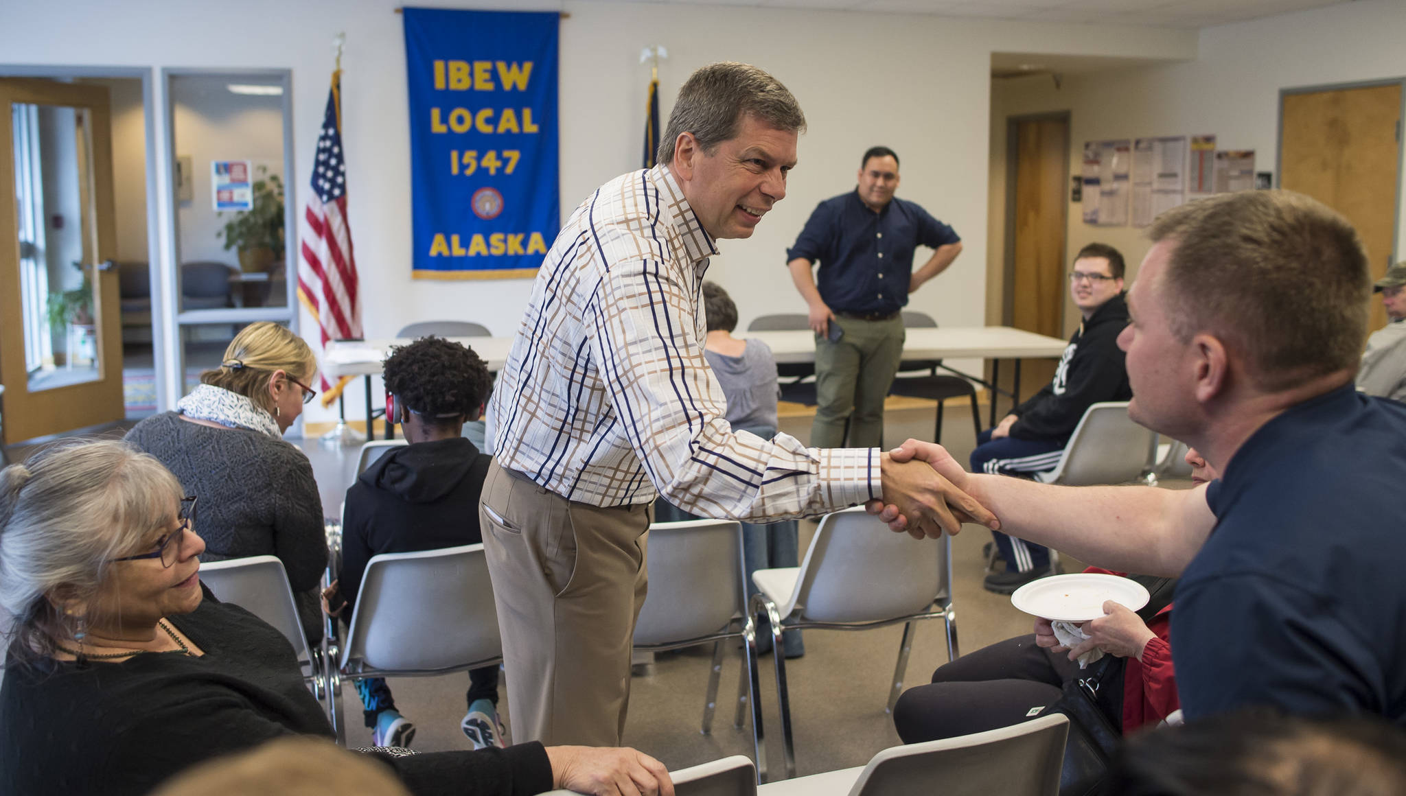 Former Alaska U.S. Senator Mark Begich greets and speaks to Juneau residents interested in his campaign for governor at the IBEW Local 1547 Union office on Thursday, June 29, 2018. (Michael Penn | Juneau Empire File)