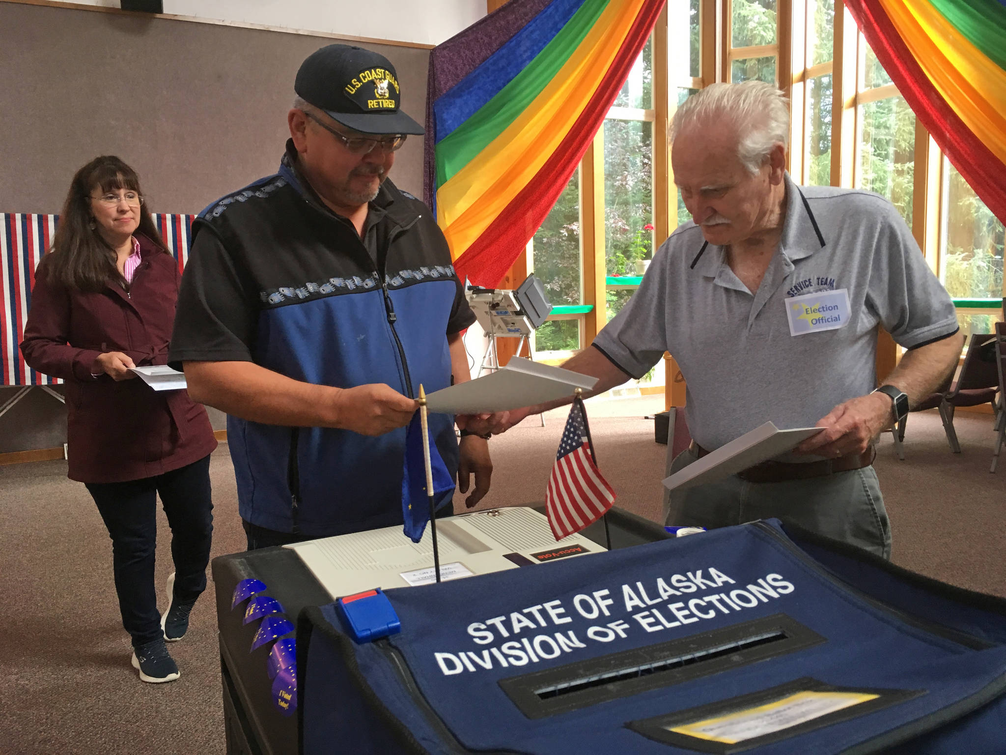 Rob Edwardson, Democratic candidate for House District 34, casts his ballot Tuesday, Aug. 21, 2018 at Aldersgate United Methodist Church. At background is Edwardson’s wife, Sandy. (James Brooks | Juneau Empire)