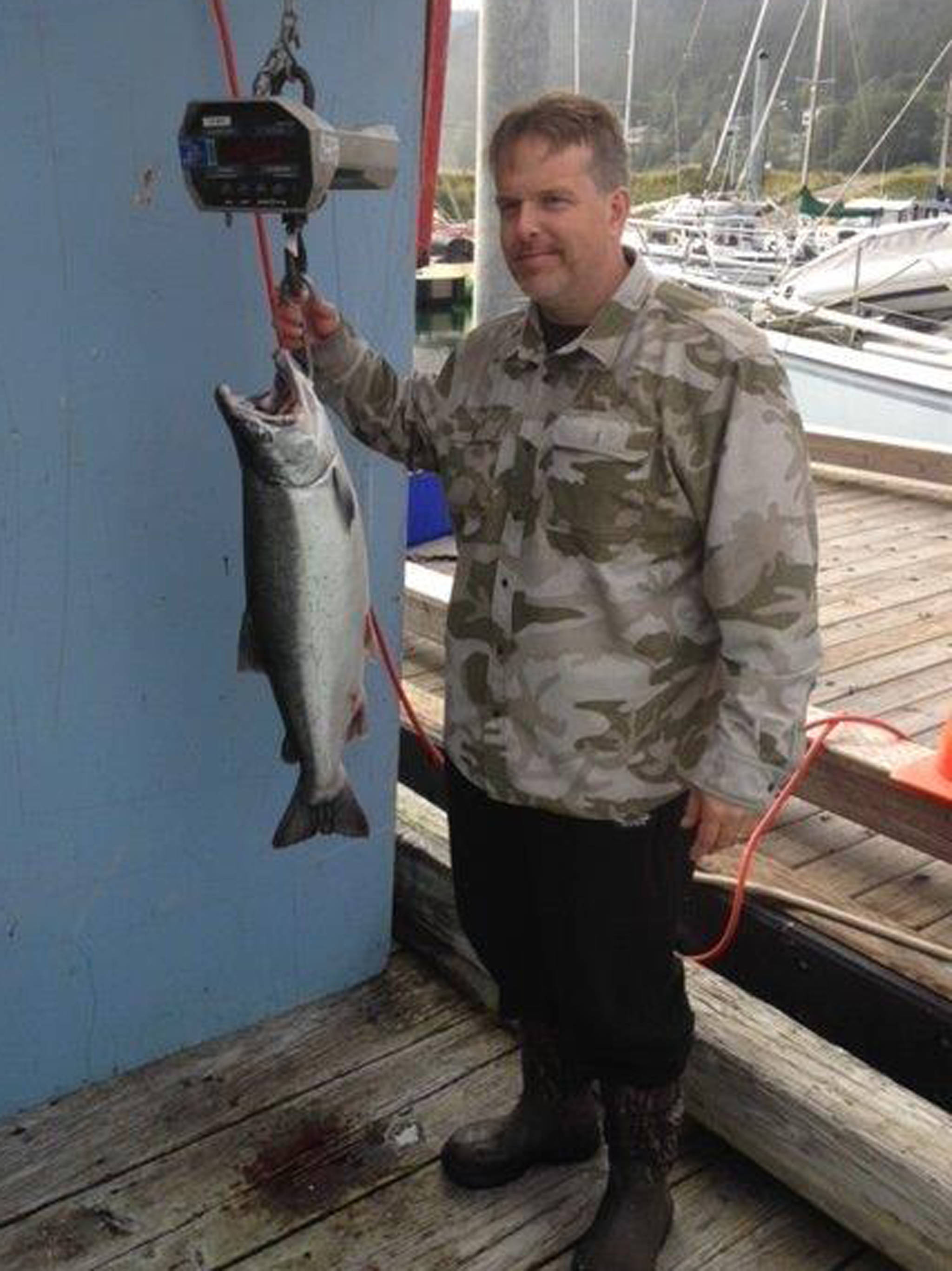 James McKnight holds a coho salmon he caught on Saturday, Aug. 18, 2018 at the Golden North Salmon Derby. The fish, weighed at 17.7 pounds, was the largest one caught at the derby. (Courtesy Photo | Derby Committee)