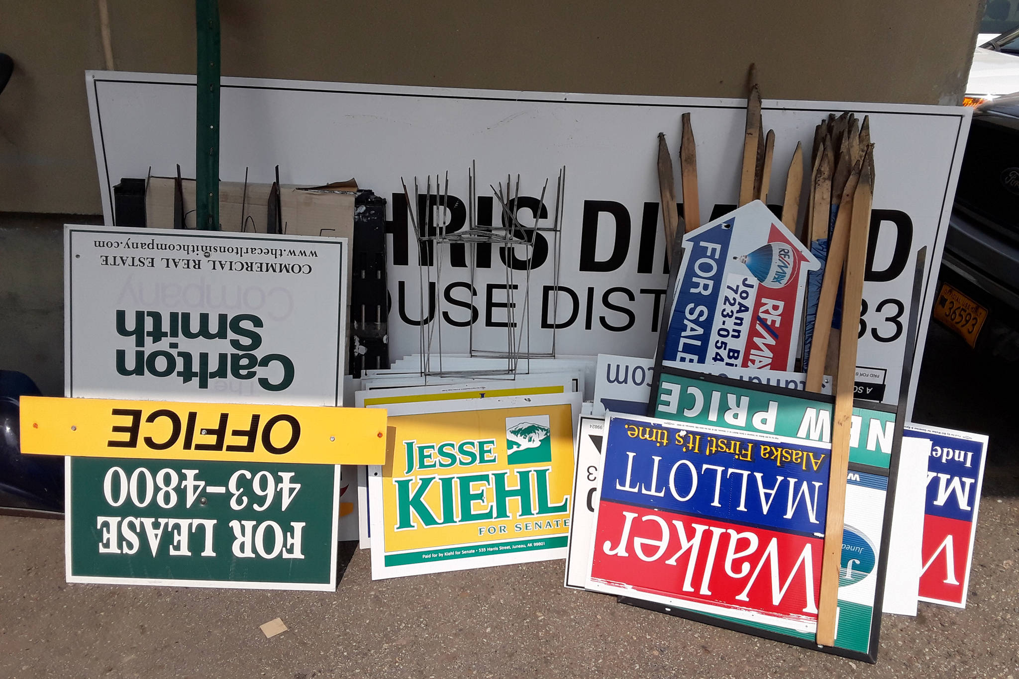 A collection of signs confiscated in Juneau is seen at an Alaska Department of Transportation and Public Facilities facility on July 24, 2018 in this image provided by the DOT. (Courtesy photo)