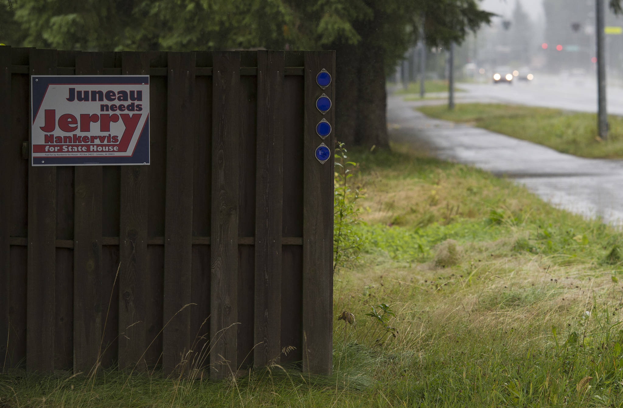 A Jerry Nankervis for state house election sign on Mendenhall Loop Road on Friday, Aug. 24, 2018. Alaska statute states signs on private or commercial property cannot be located within 660 feet of a state-maintained road or “with the purpose of their message being read from the main traveled way.” (Michael Penn | Juneau Empire)