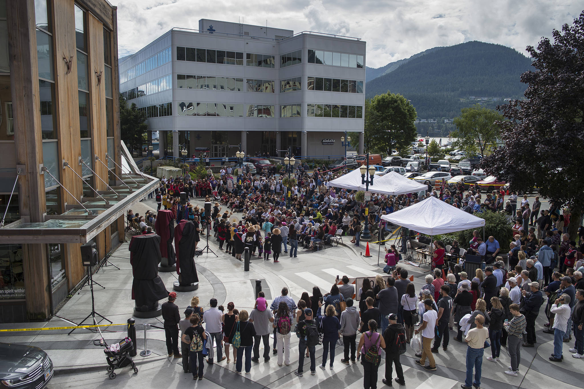 Three bronze house posts dedicated during a ceremony in front of the Walter Soboleff Center by Sealaska Heritage Institute on Sunday, Aug. 26, 2018. (Michael Penn | Juneau Empire)