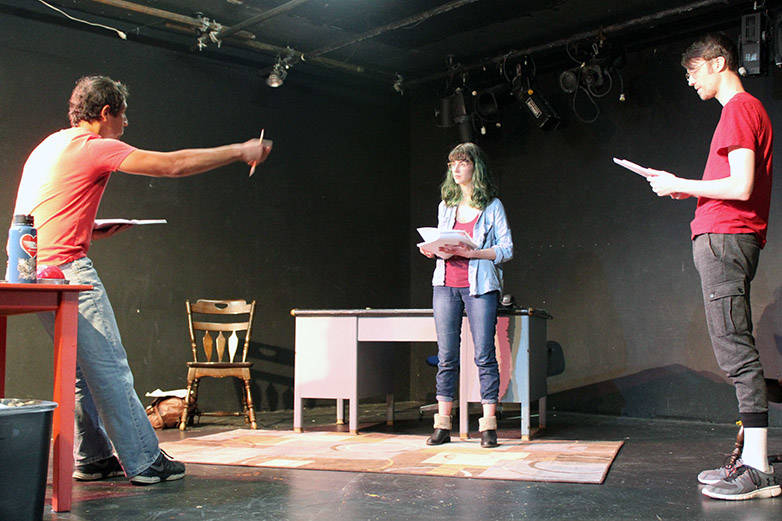 Enrique Bravo, left, directs Erika Bergren, center, and Bryan Crowder, right, during a rehearsal of Perseverance Theatre’s Black Box series play “Oleanna.”