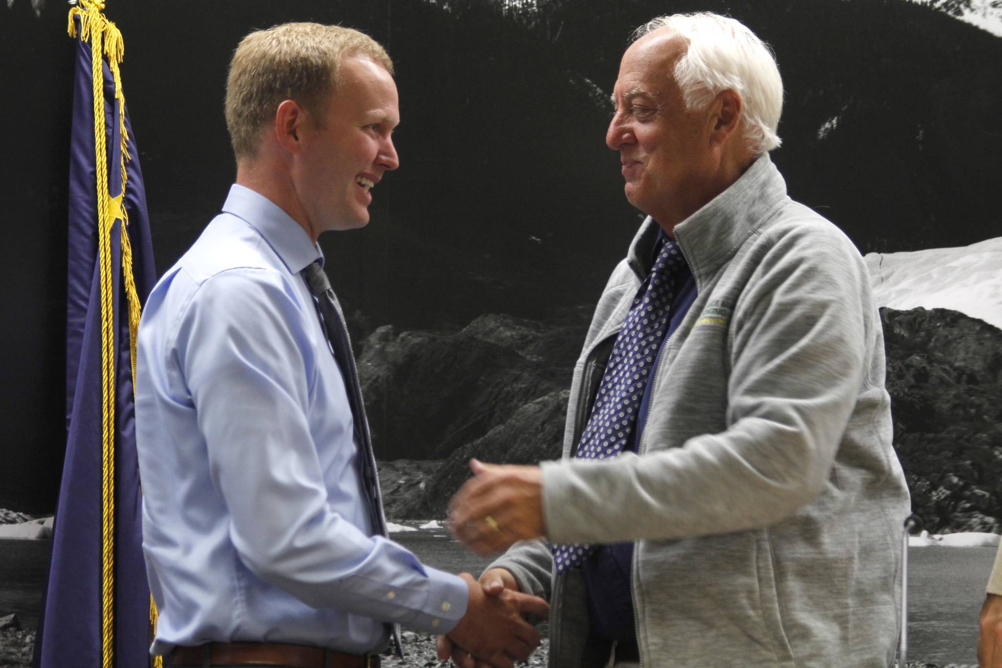 City Attorney Robert Palmer (left) shakes hands with Mayor Ken Koelsch moments after being named the City and Borough of Juneau’s municipal attorney. Palmer replaces Amy Mead, who was selected to be a Superior Court judge this summer. (Alex McCarthy | Juneau Empire)