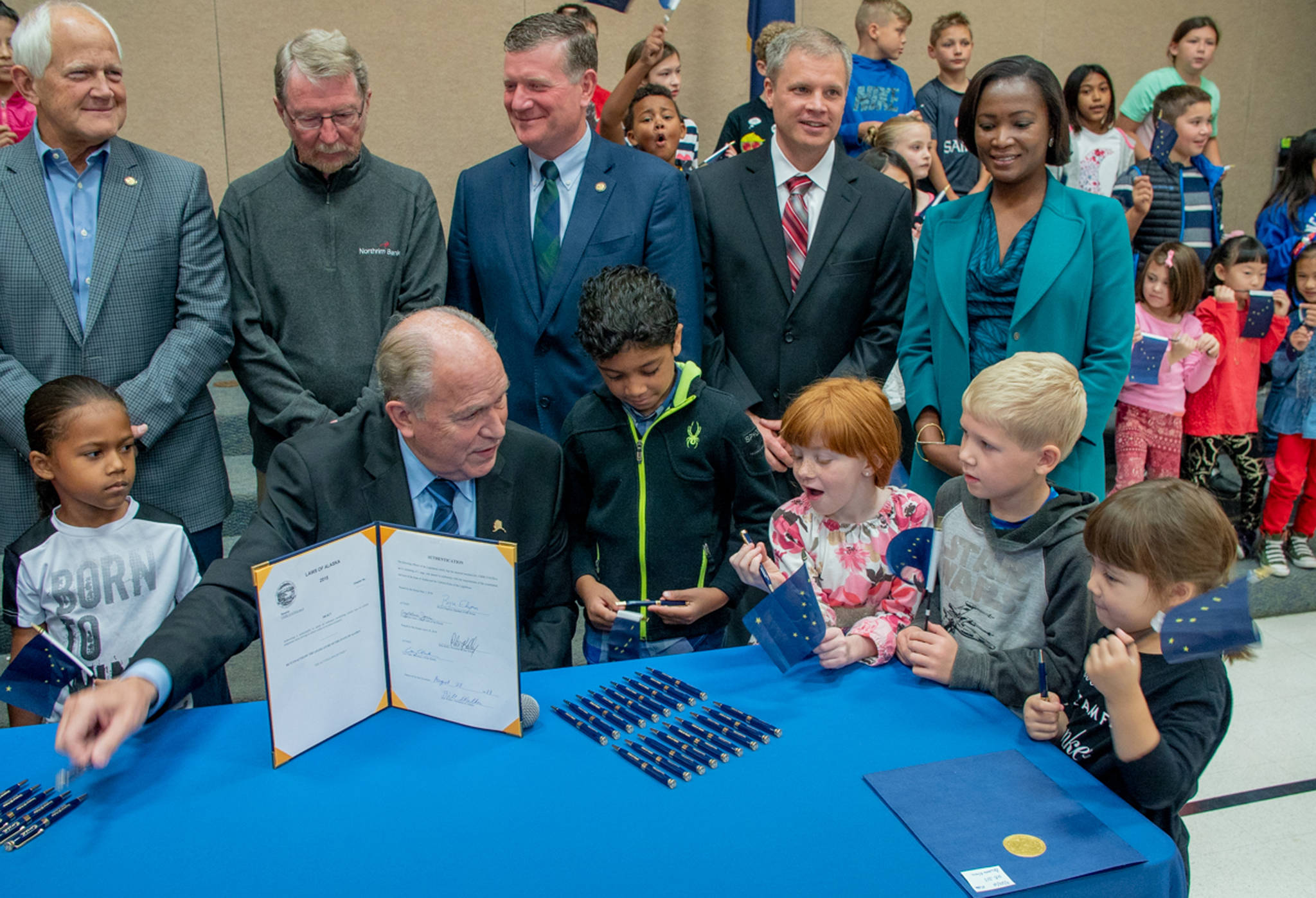 Governor Walker signs House Bill 333 at Bowman Elementary School on Tuesday, Aug. 28, 2018 in Anchorage. (Brice Habeger photo | Office of the Governor)