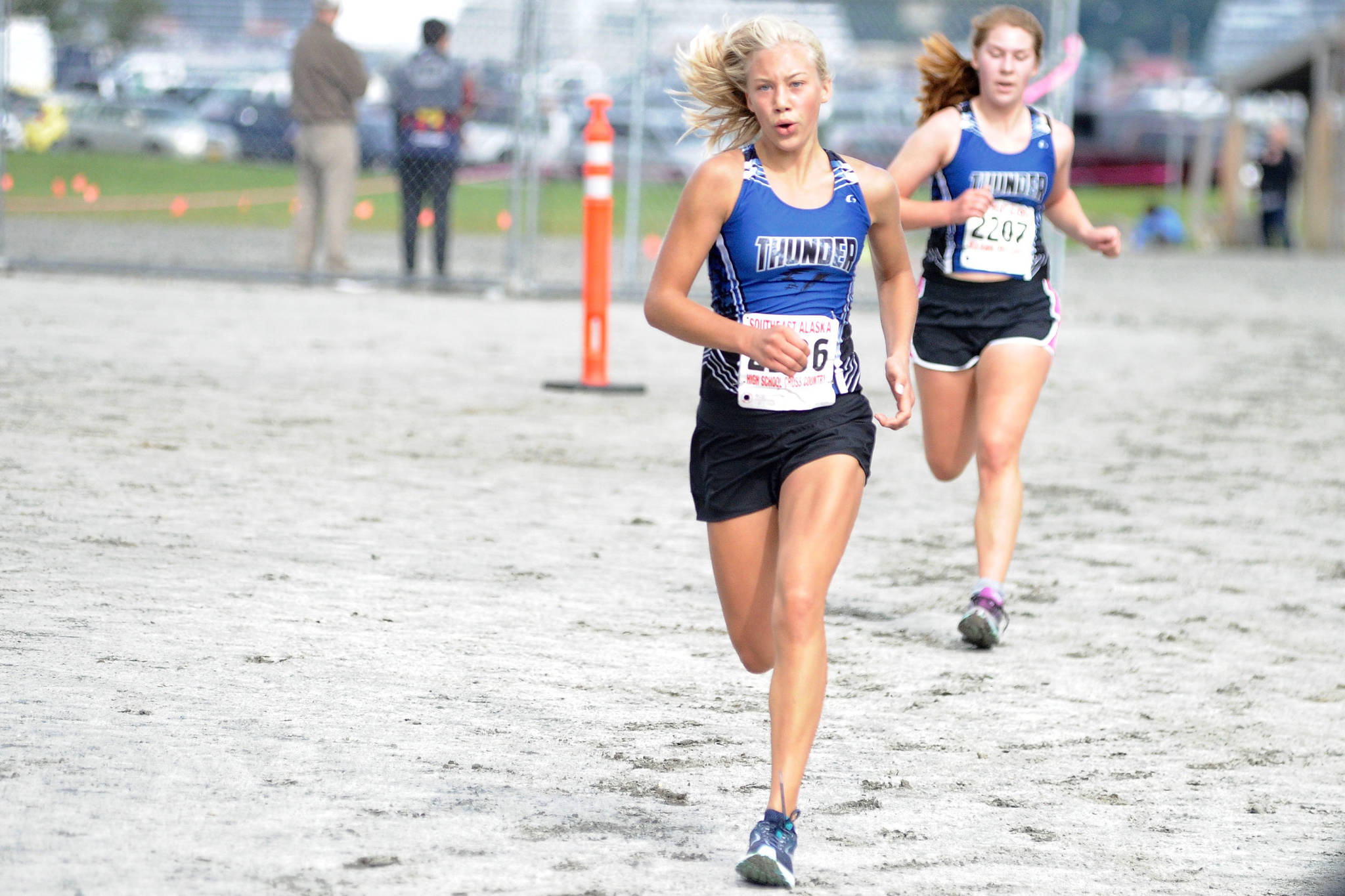 Thunder Mountain’s Hannah Deer, front, leads Sally Thompson to the finish line during the Douglas Island Mini-Meet at Savikko Park on Saturday, August 18. Deer and Thompson will anchor the TMHS girls cross country running team this season under new head coach Sandi Pahlke. (Nolin Ainsworth | Juneau Empire)